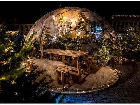 Dining area in a Christmas Hypedome bubble pod