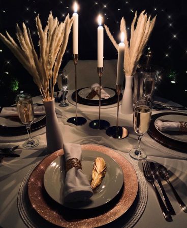 Table prepared for dining in a dome with candles