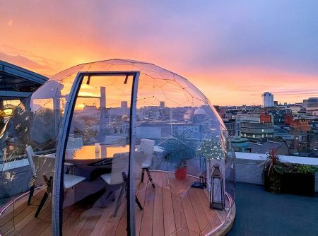 Rooftop dining dome at dusk