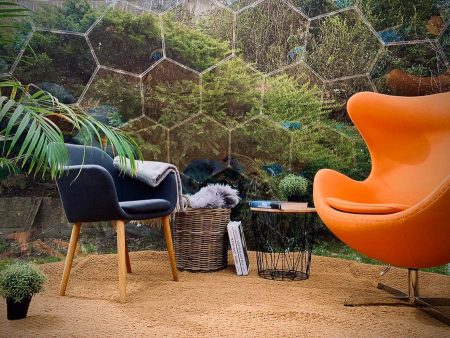 Orange and black armchairs in a garden igloo dome