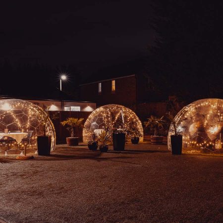 Dining domes with lights at night