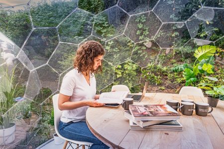 Blogger working in a garden dome