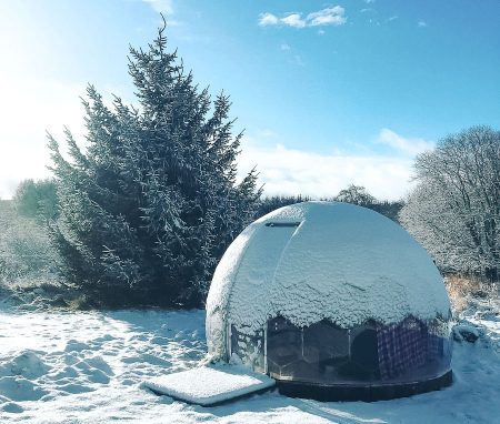 Geodesic dome covered in snow