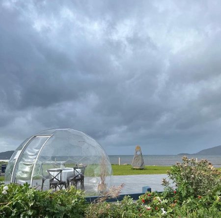 Hypedome on the coast, with dark clouds in the background