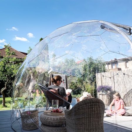 A family spending time in a garden dome in summer