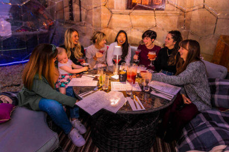 A group of friends dining out in a dome