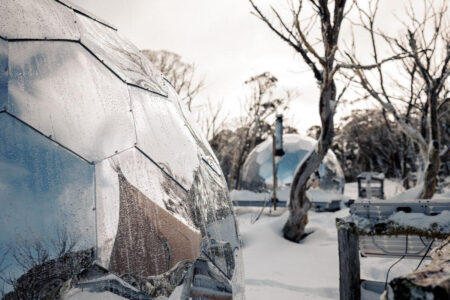 Glamping pods with mirror finish in the snow