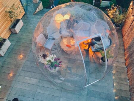 Women having chat in a garden she shed dome