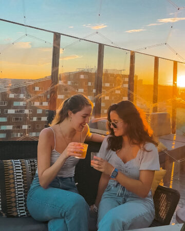 Two friends having a drink in the she shed kit