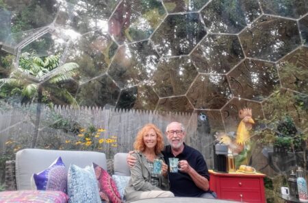 Susan and Sheldon sitting in their backyard room in Maine