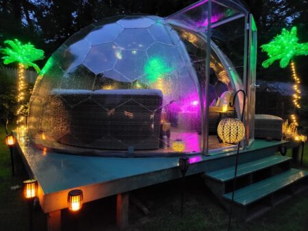Backyard living room in a dome by night