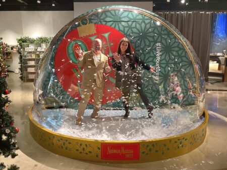 People inside a Christmas life-size snow globe