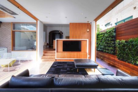 A large living space with greenery and plant wall