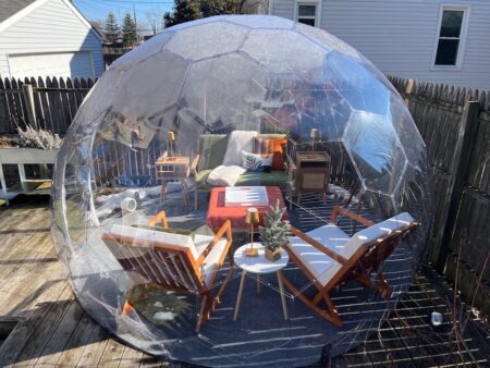Robert's sleek clear backyard dome with cozy furnishings