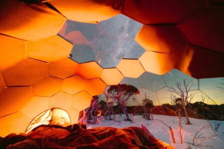 A skylight in a glamping dome allowing for a stargazing experience while falling asleep