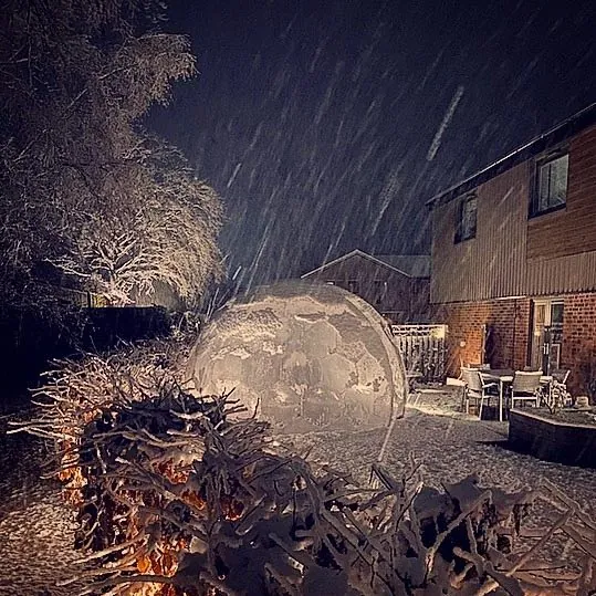 Transparent garden igloo dome in the rain