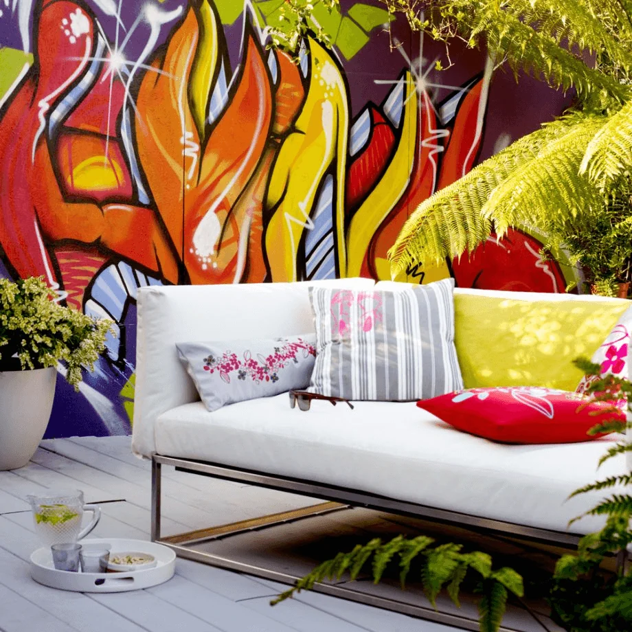 Outdoor lounge against the colourful wall