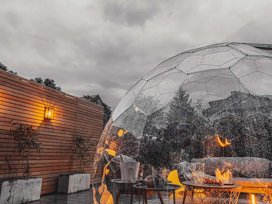 Illuminated garden pod against the overcast sky