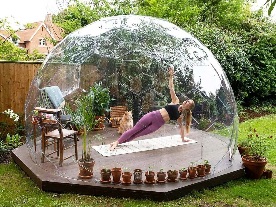 Practicing yoga in a garden pod