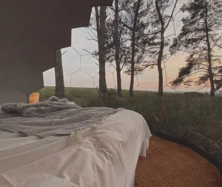 Outdoor bedroom in a glamping dome