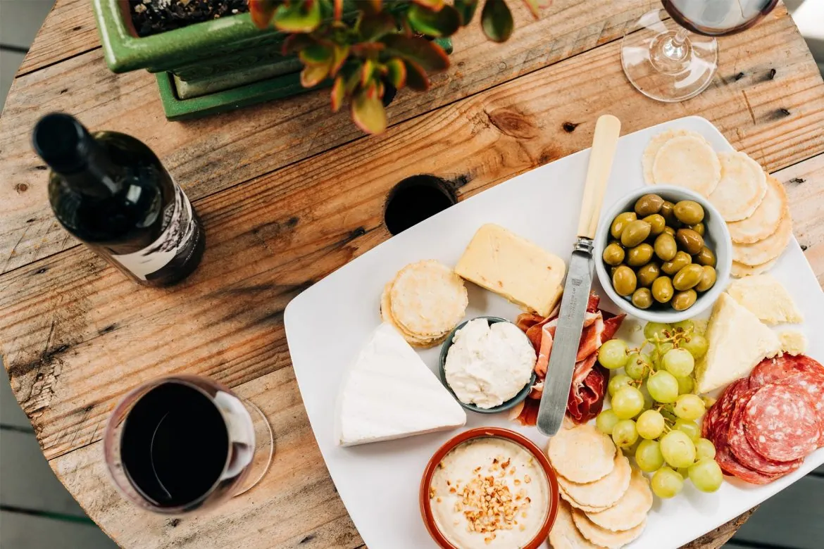 Alfresco dining - easting menu and wine on a table