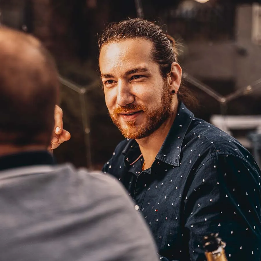 A man enjoying his time in a dining dome with friends