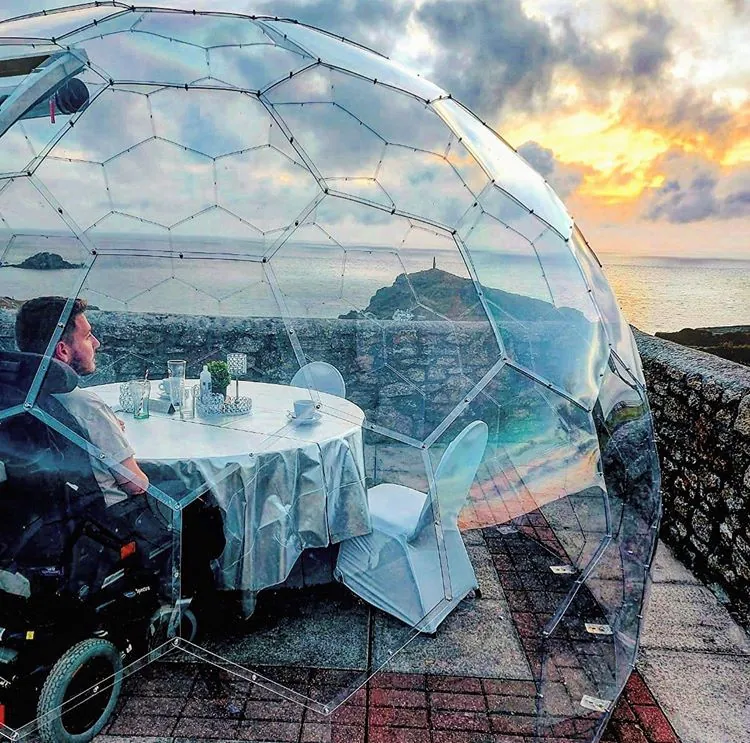 A man in a wheelchair in a dining pod