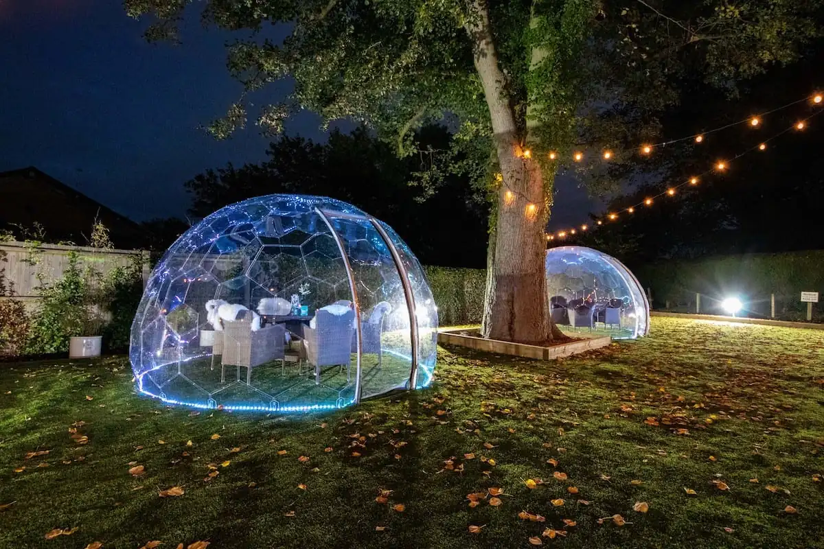 Outdoor dining pods in autumn scenery