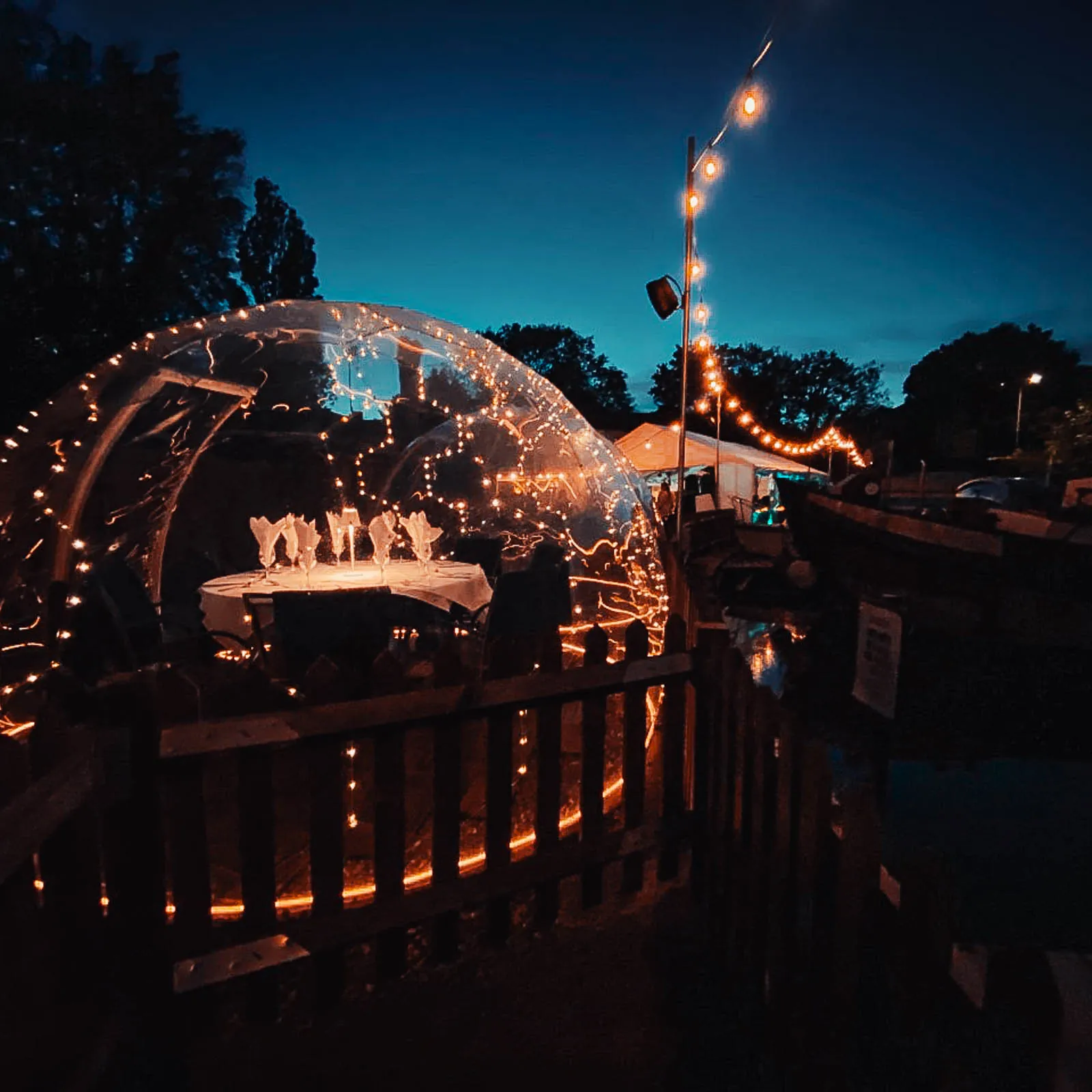 Illuminated dining domes by night