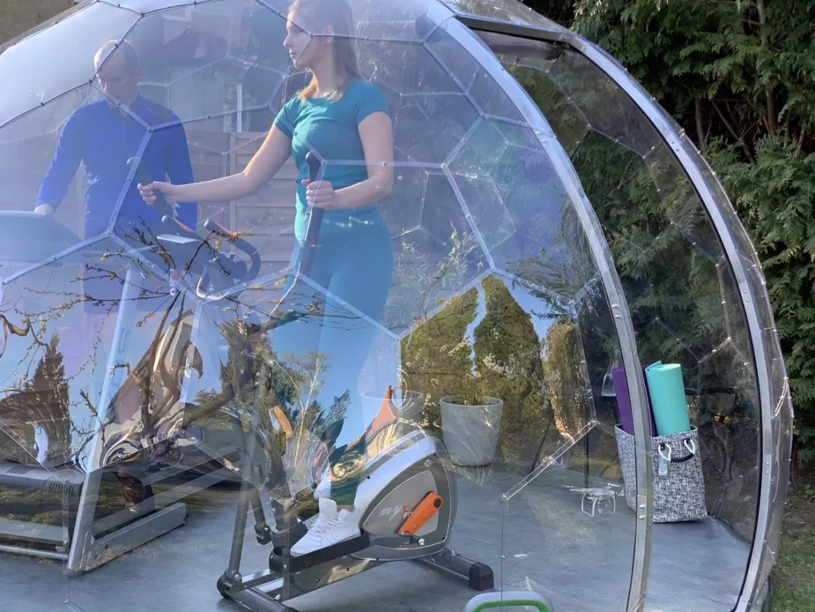 A couple working out in a garden gym