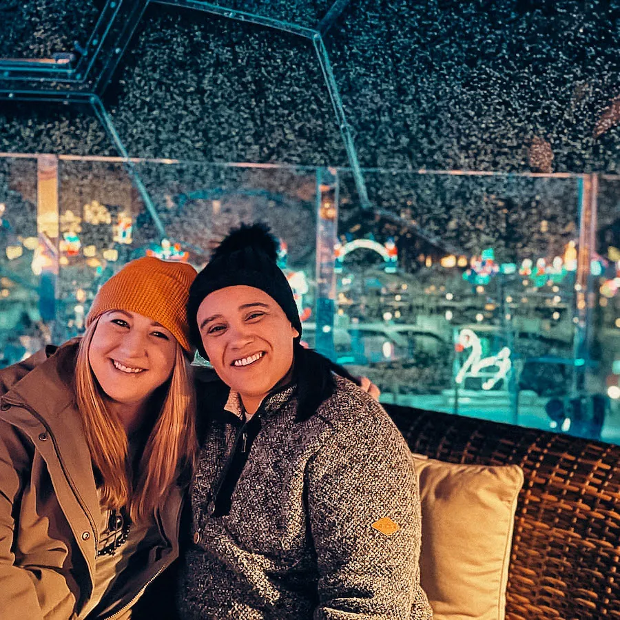 Friends hanging out in a rainproof geodesic dome