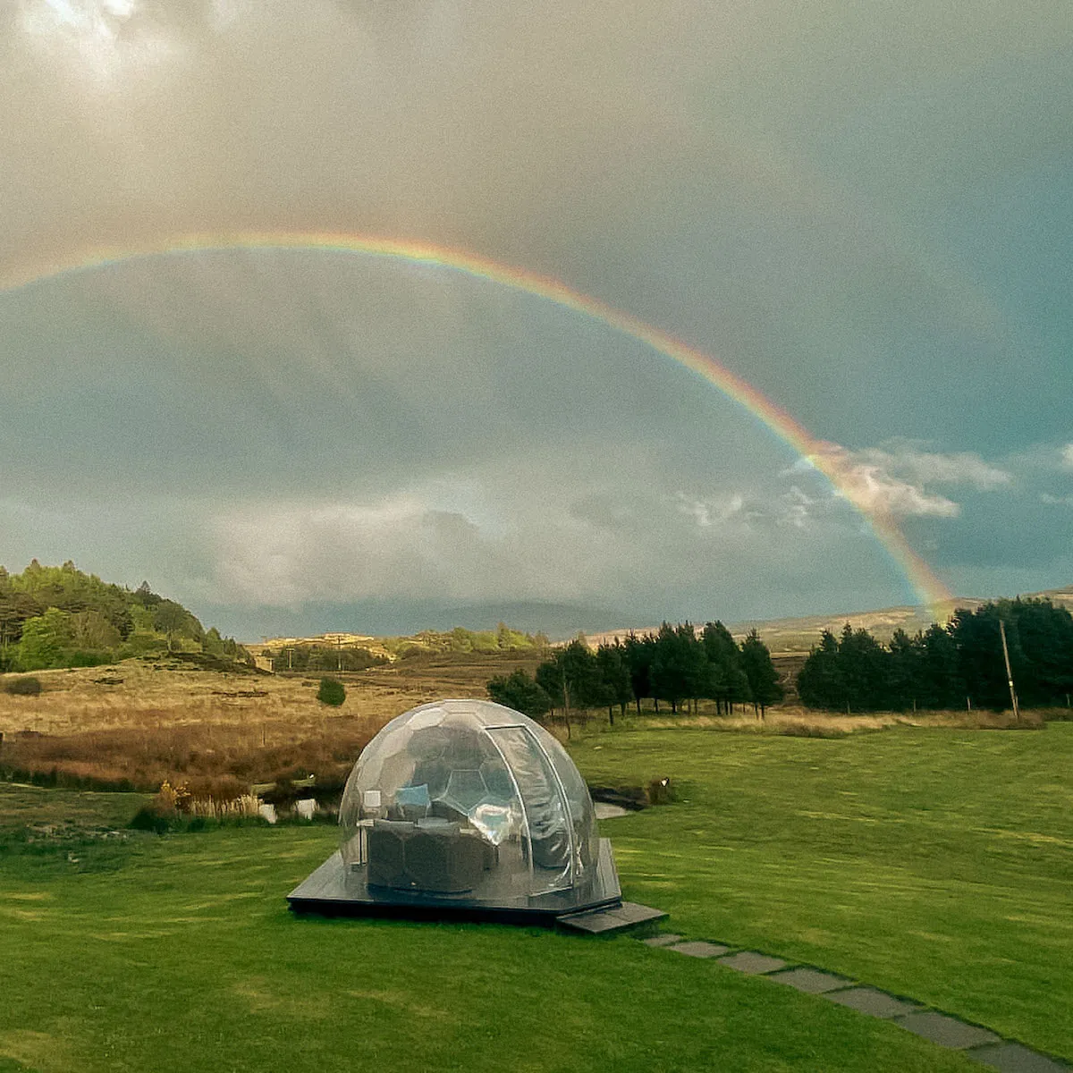 A rainbow over a rainproof geodome