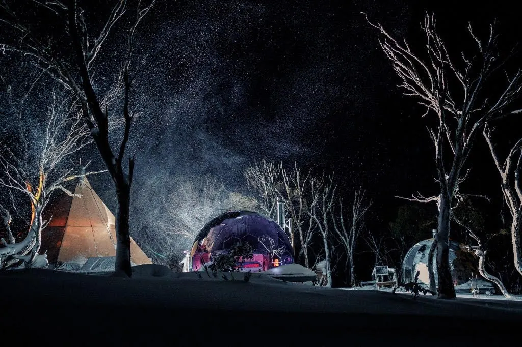 A beautiful Hypedome glamping geodesic dome by night