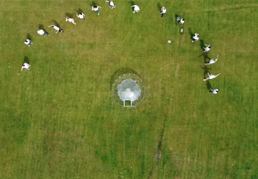 Throwing golf balls against a garden pod to test its hail resistance