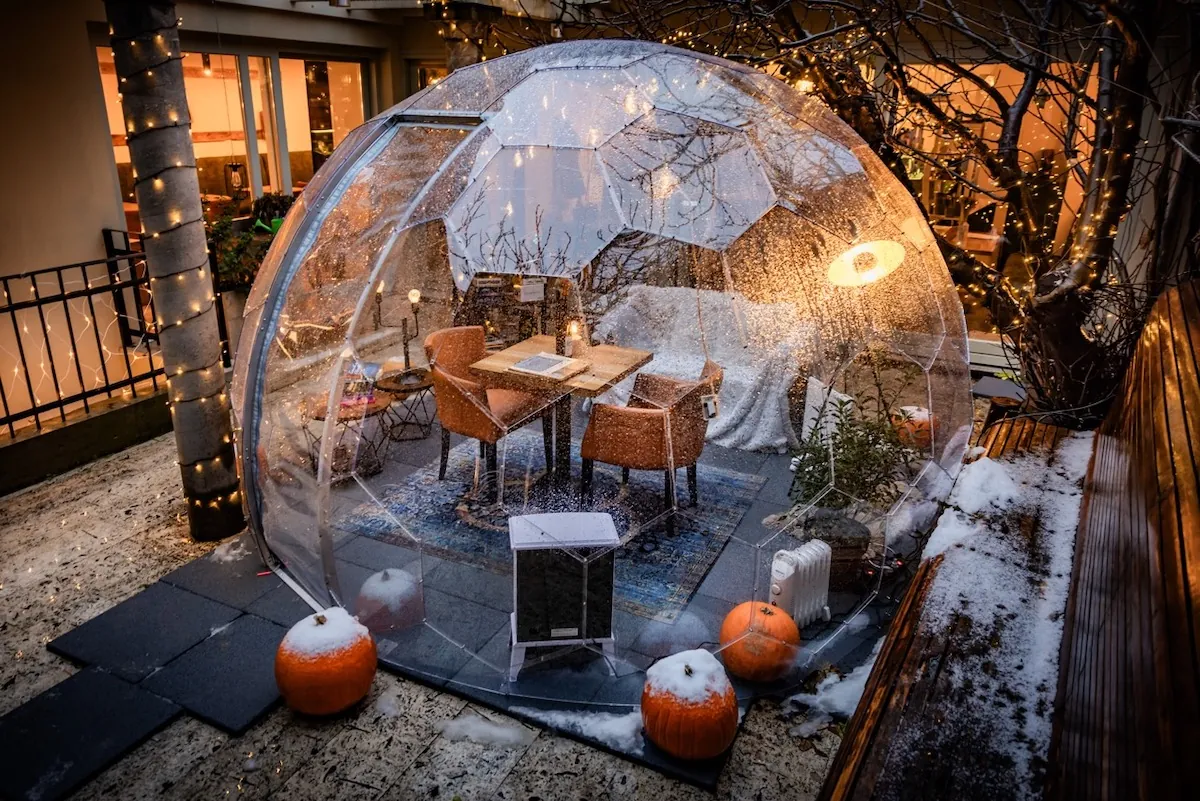 Beautifully lit dining dome at Teyfol restaurant in Budapest