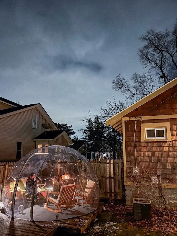 Inviting and cozy backyard igloo at night