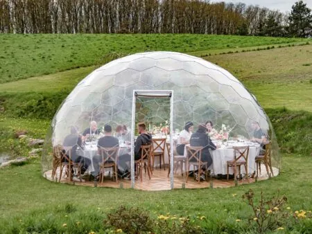 People dining in the large geodesic dome Hypedome L