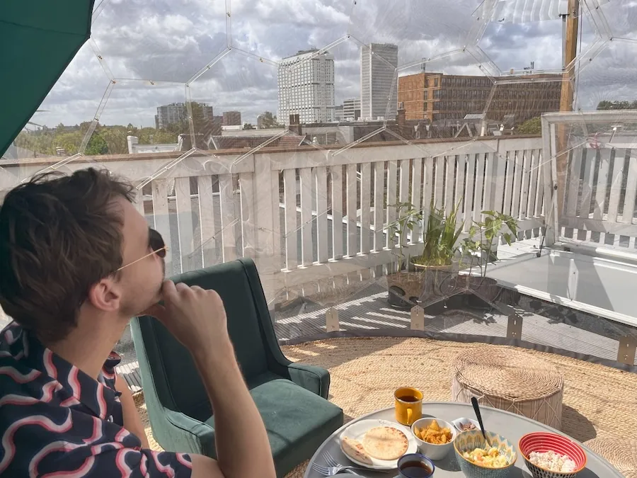 Looking at the city from inside of the rooftop dome