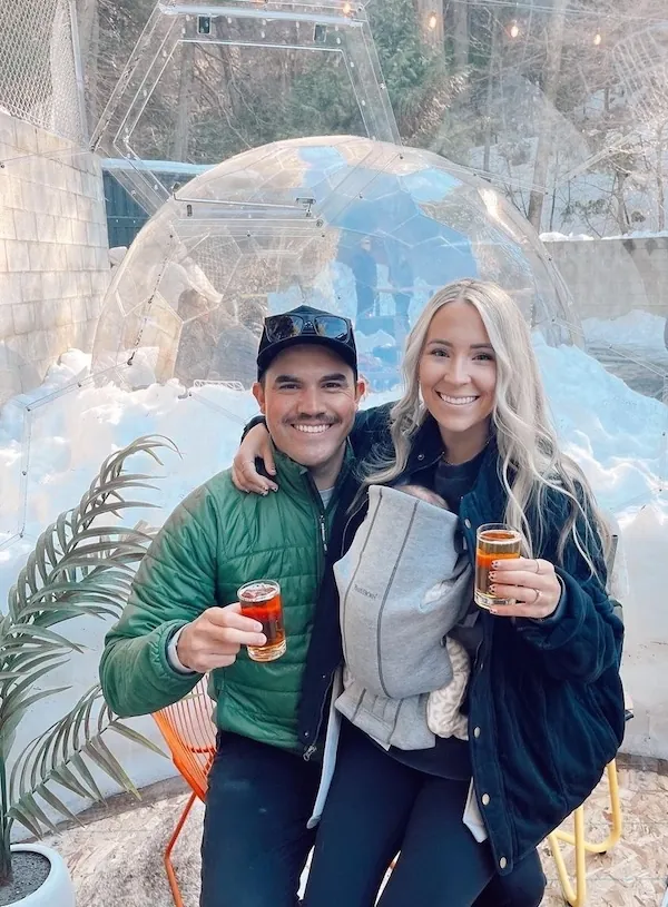 A couple hanging out in an apres-ski dome in a bar