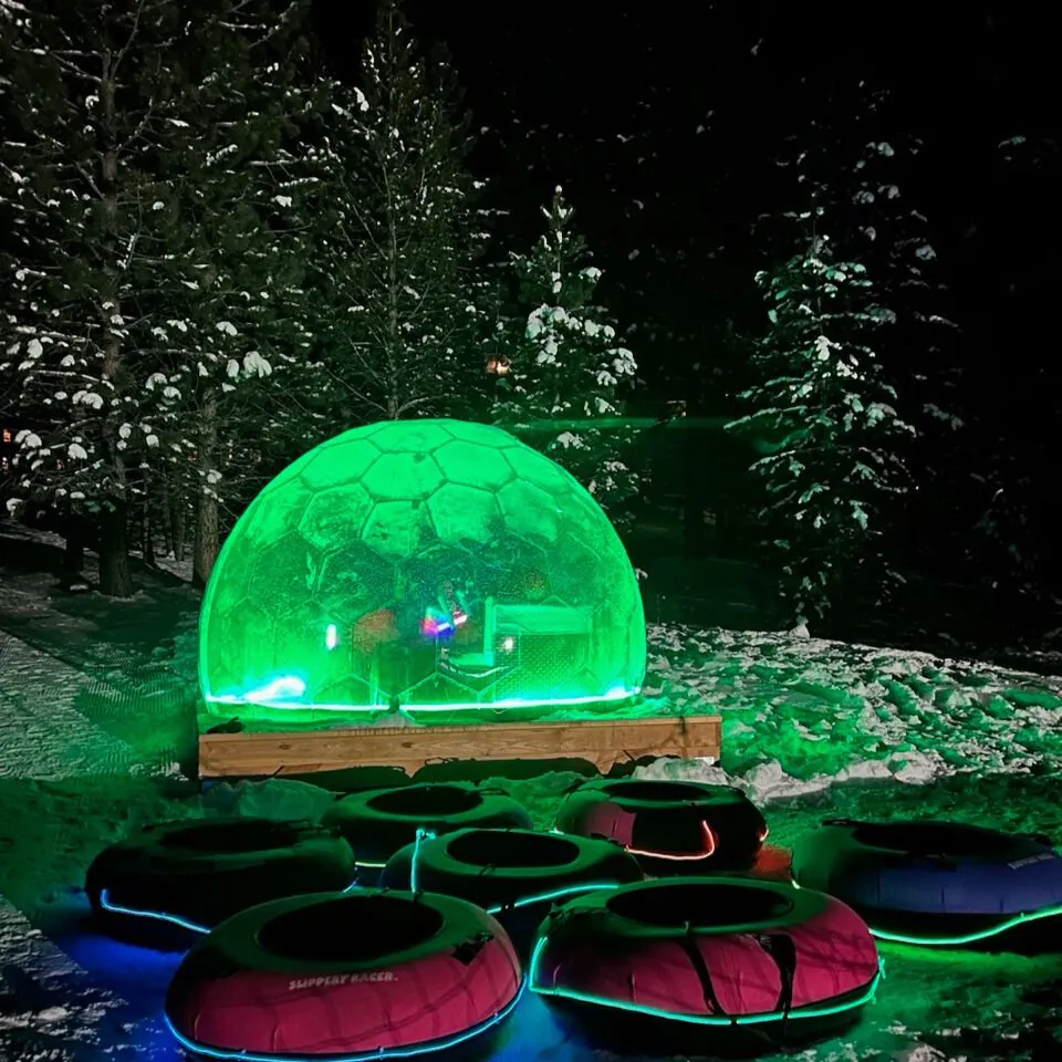 An illuminated dome in the snow