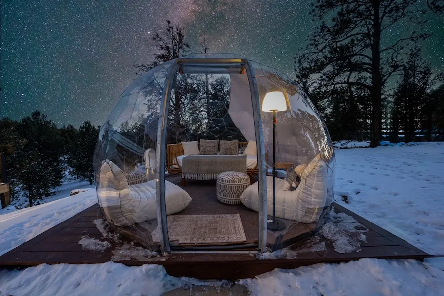 A stargazing outdoor room by night, as an Airbnb feature