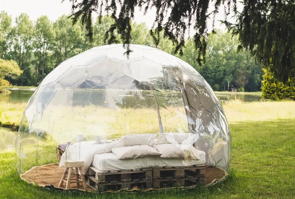 A clear outdoor bedroom dome