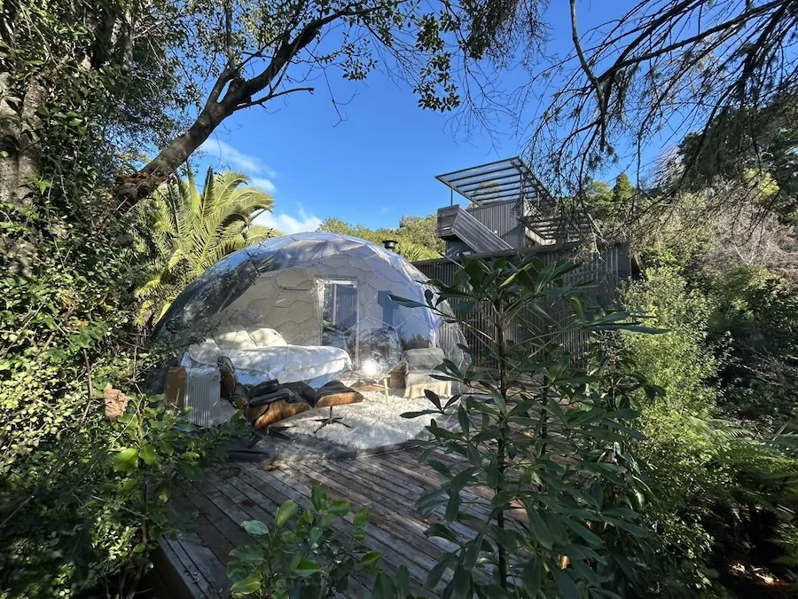 Garden bedroom dome surrounded by greenery