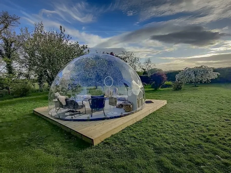 A clear garden dome against the cloudy sky