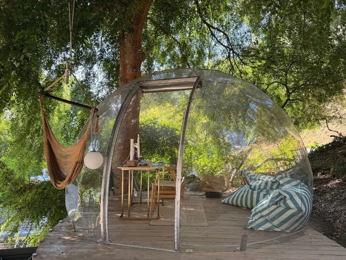 A cozy outdoor office space in a Hypedome