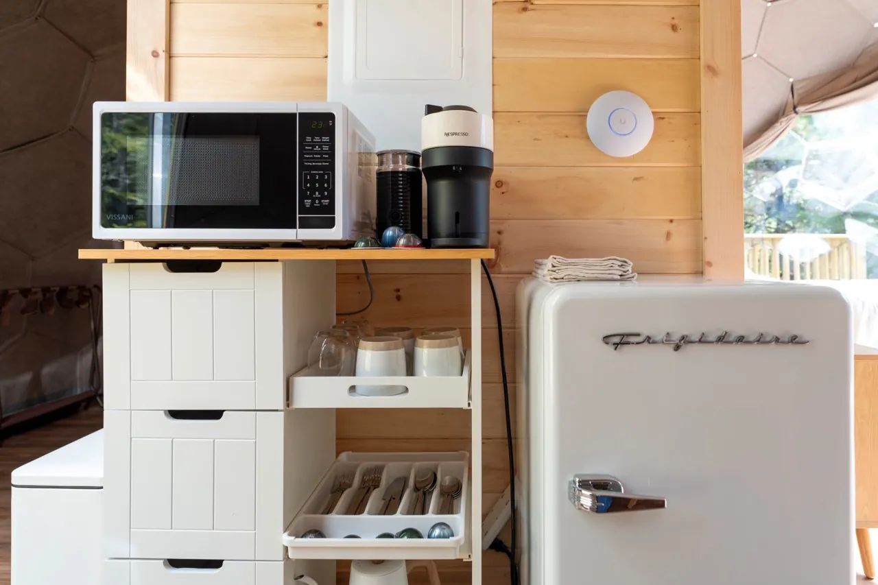 A kitchen section in a glamping dome suite