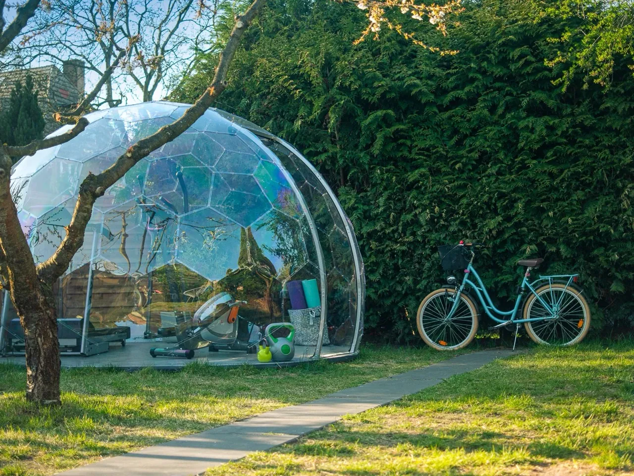 A Hypedome set up as a garden room, with the surrounding garden in view