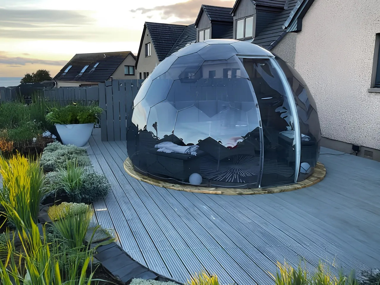 A Hypedome installed in a backyard, panels catching daylight